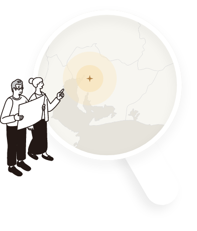 虫眼鏡の中に地図が入っていてそれを指さしている女性と男性